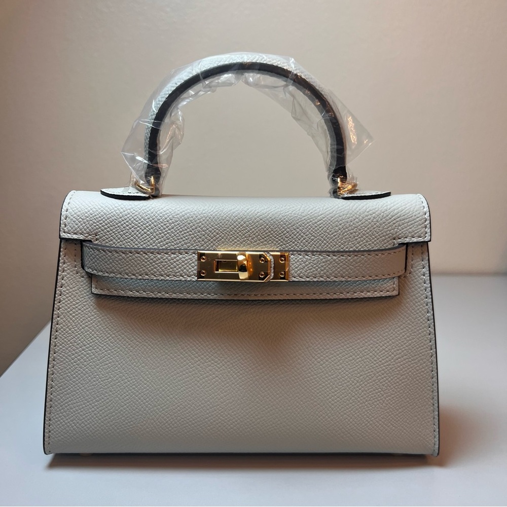 Genuine Epsom Leather mini handbag with shoulder strap featuring Gold hardware
